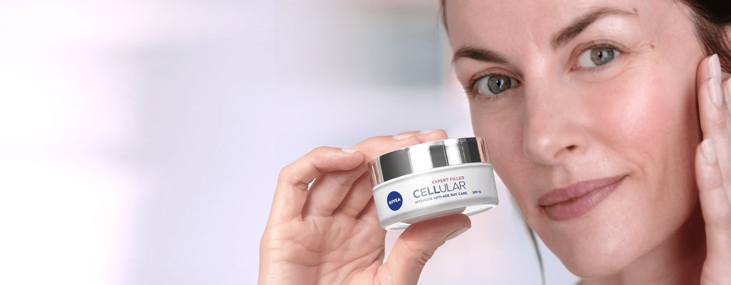 Women is applying Nivea anti wrinkle cream