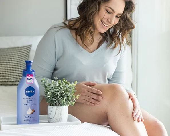 Woman using Nivea lotion