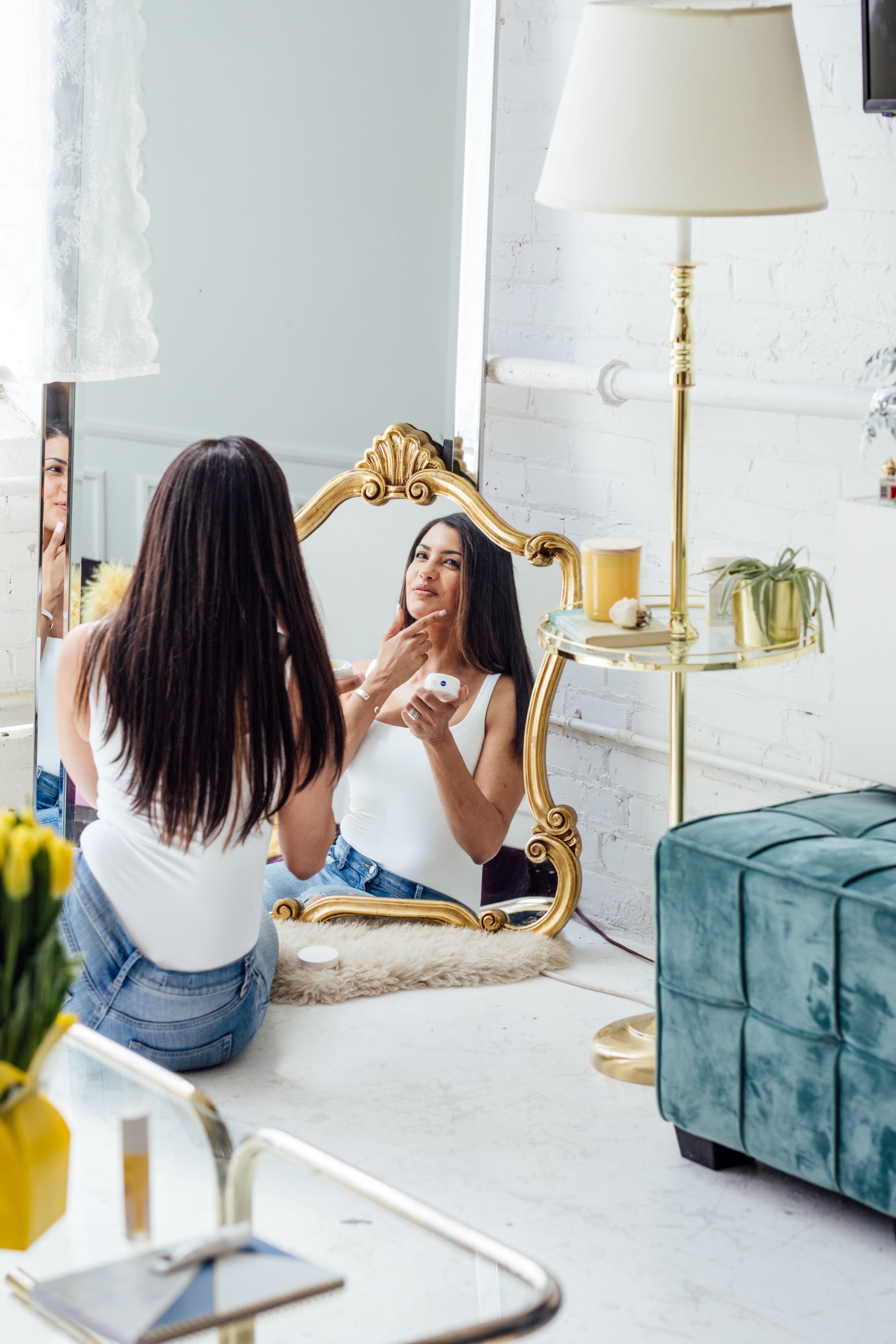 Woman applying Q10 Cream