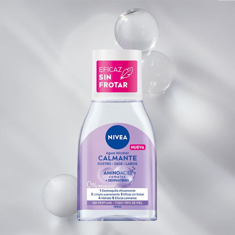 A bottle of NIVEA Micellar Water for Combination Skin lays on a green bubble textured background.