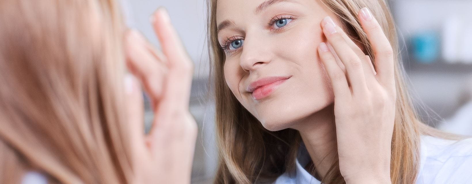 looking at skin in the mirror