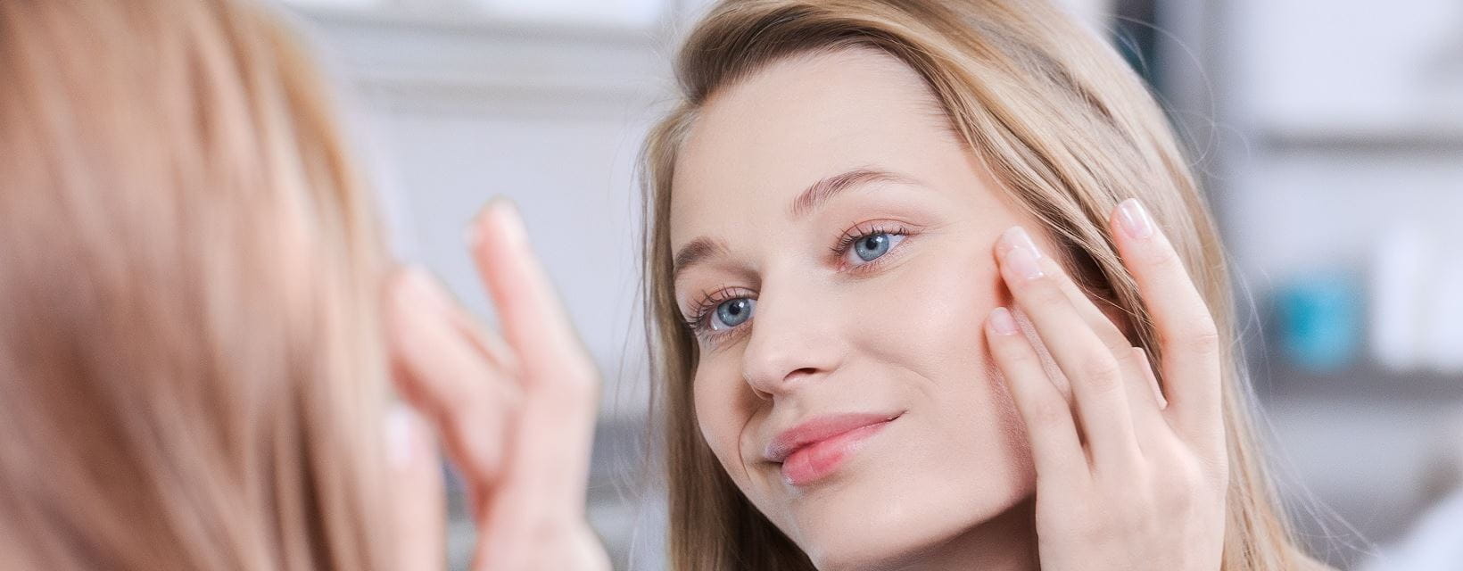 looking at skin in the mirror