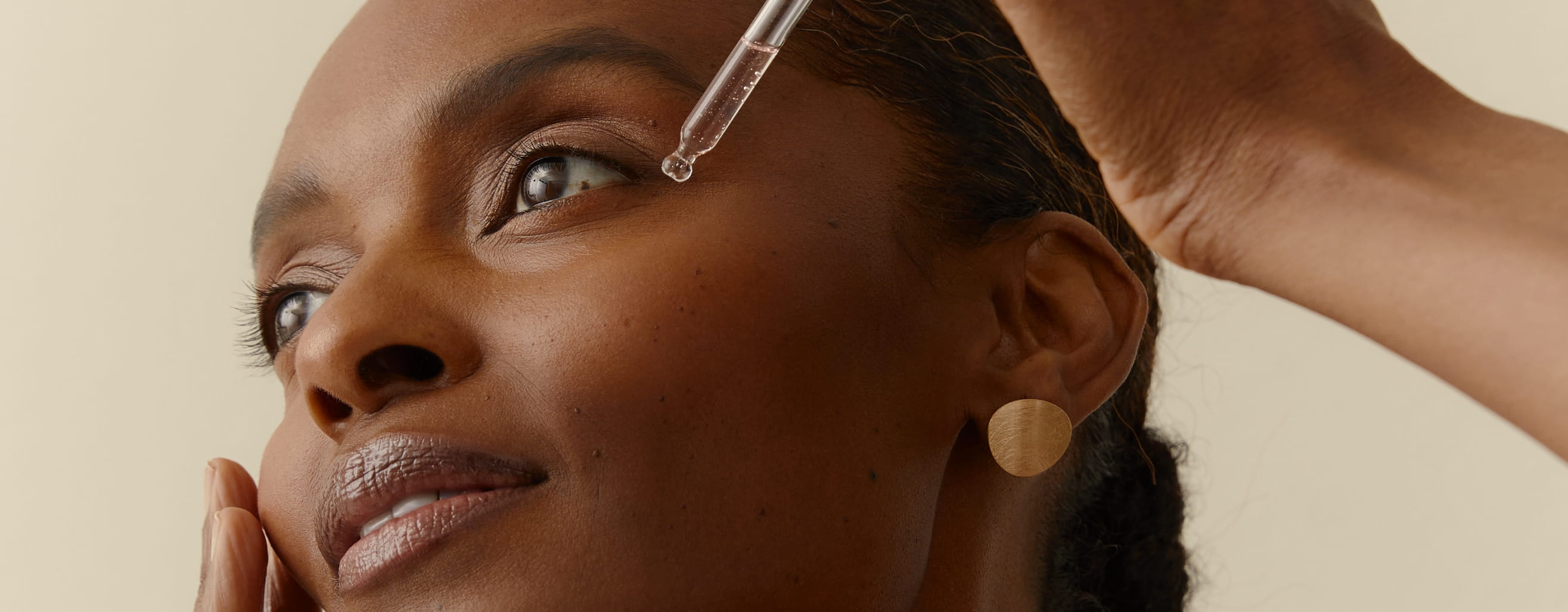 woman applying Nivea Cellular serum