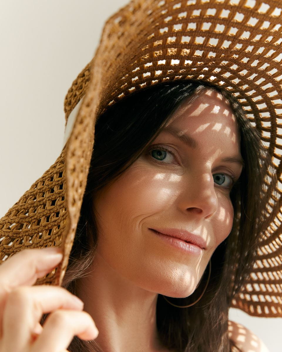 Frau mit Sonnenflecken