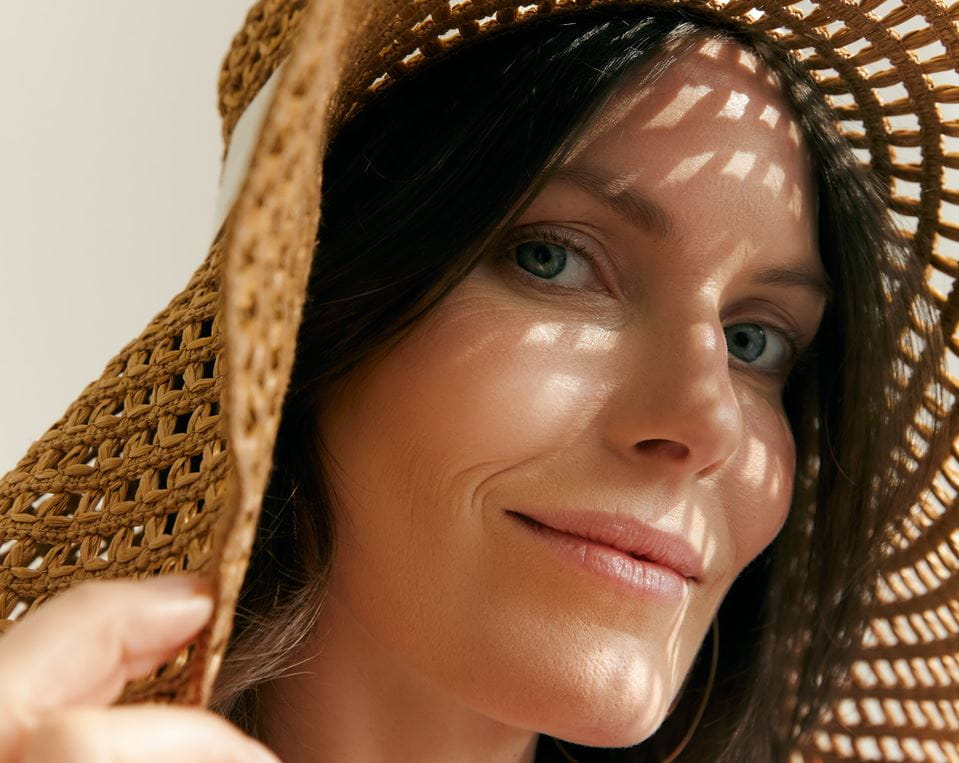 woman avoiding sun exposure