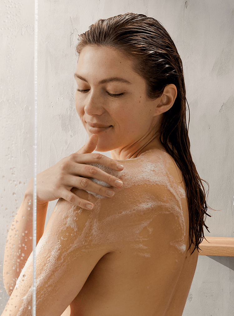 young woman using Nivea shower gel
