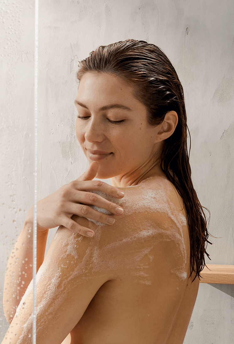 young woman using Nivea shower gel