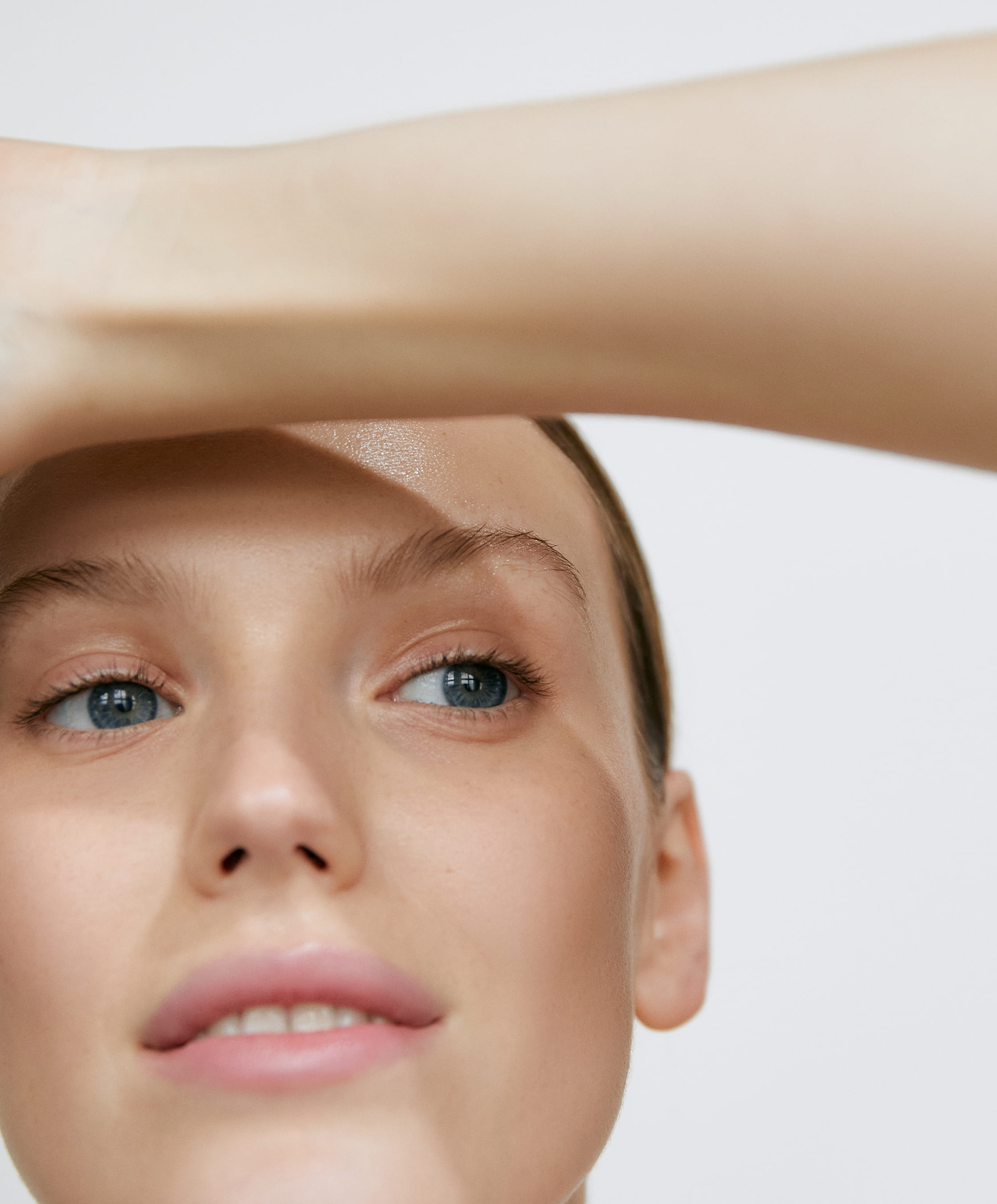 woman cleansing her face