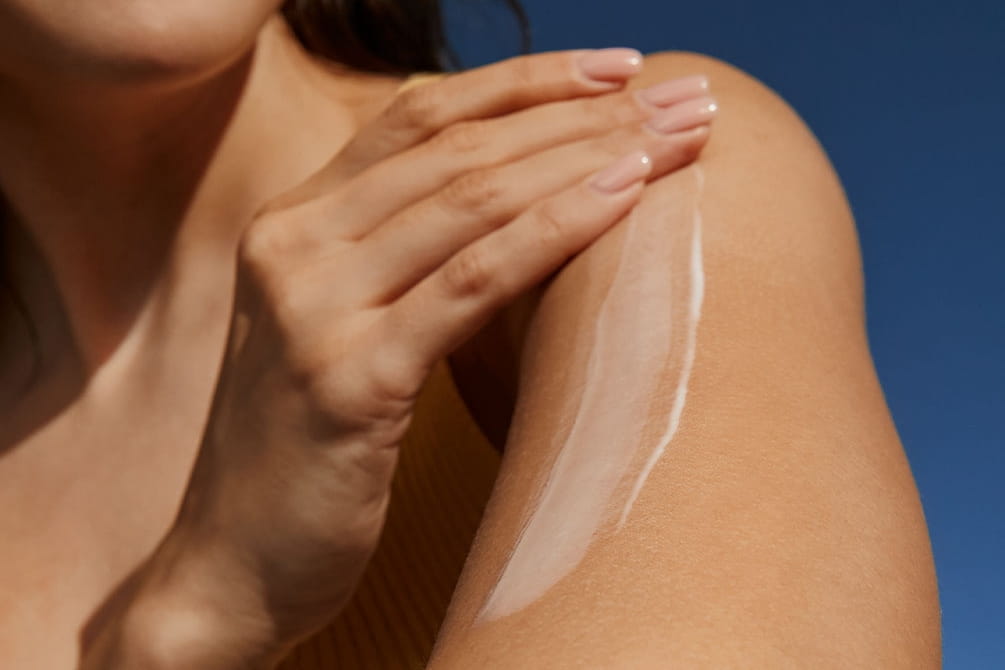 women removing peach fuzz on face