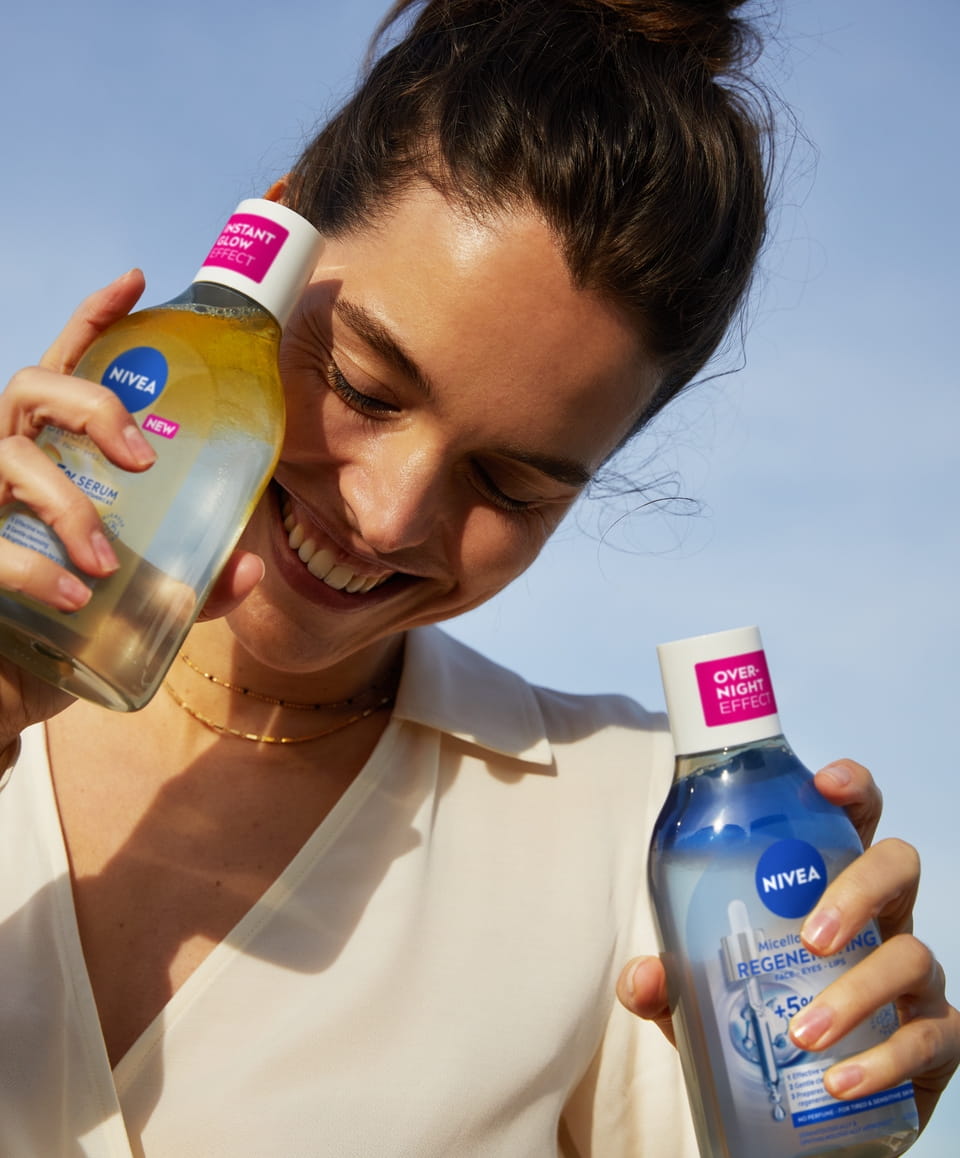 young woman using NIVEA Micellar Water Regenerating + 5% Serum with Panthenol & Squalane
