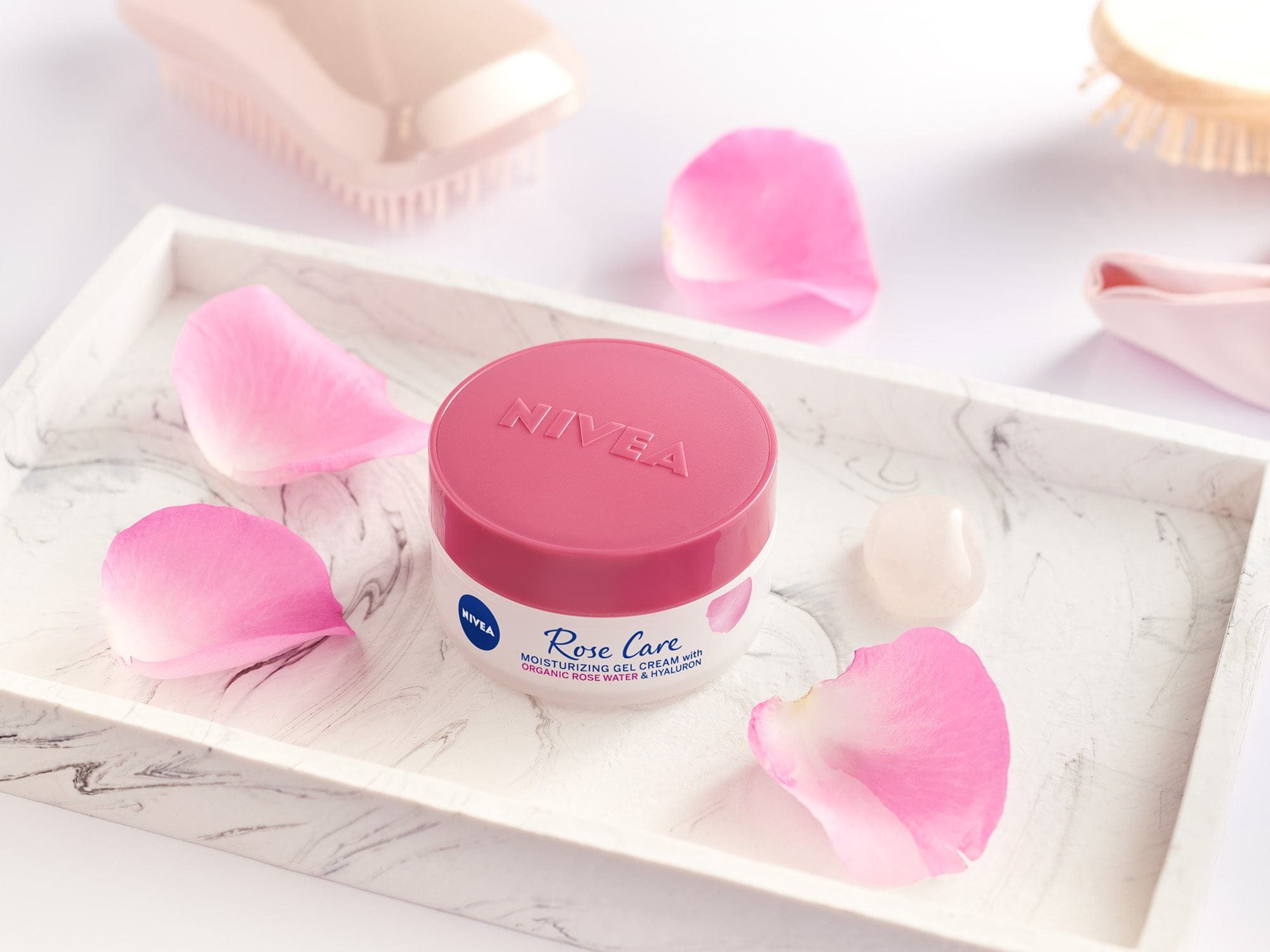 rose water face cream by nivea surrounded by rose petals