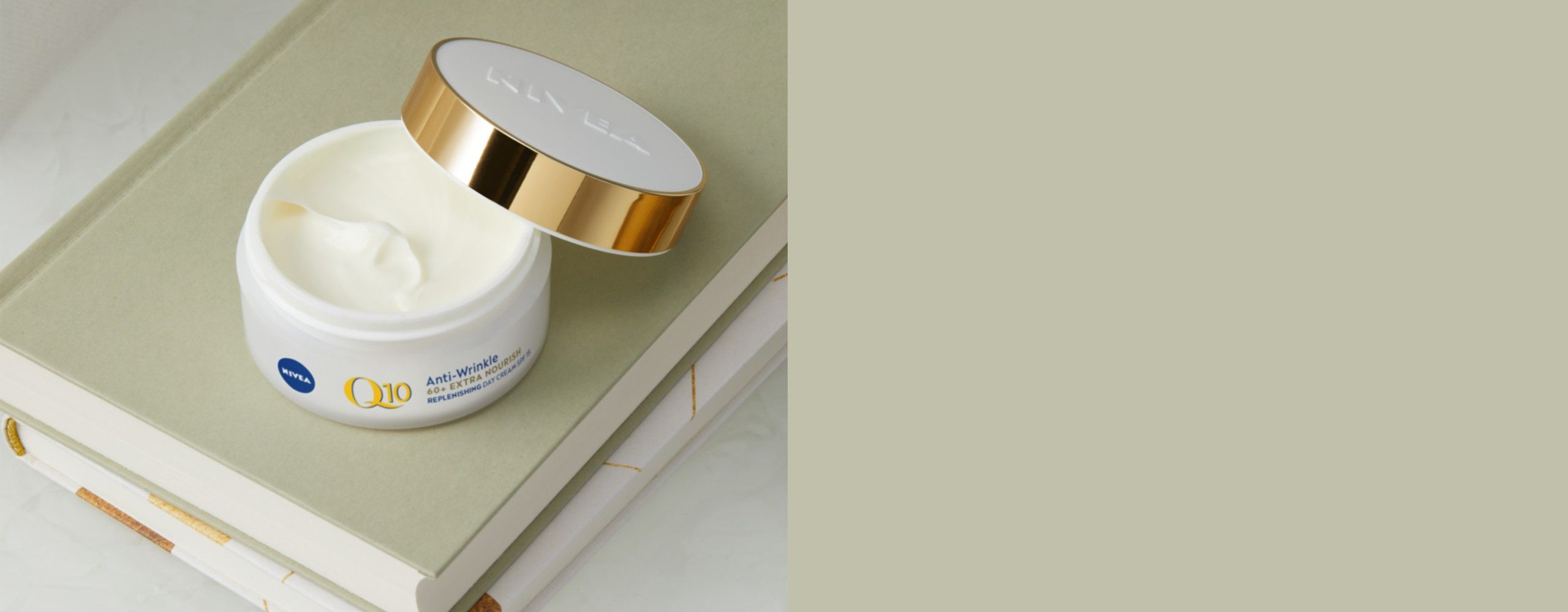 Lady smiling using anti aging cream with creatine