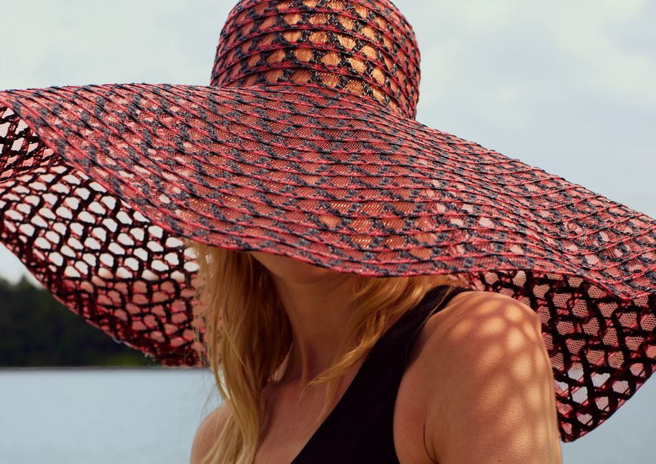 woman holding nivea face sunscreen