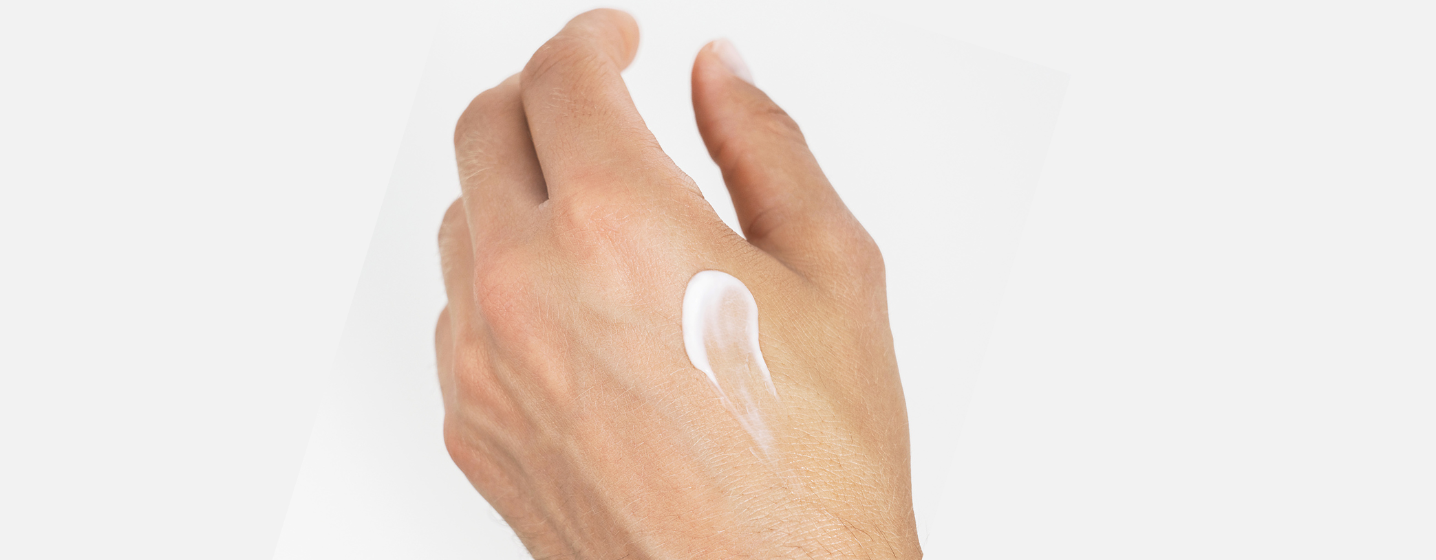 male hand with lotion on it