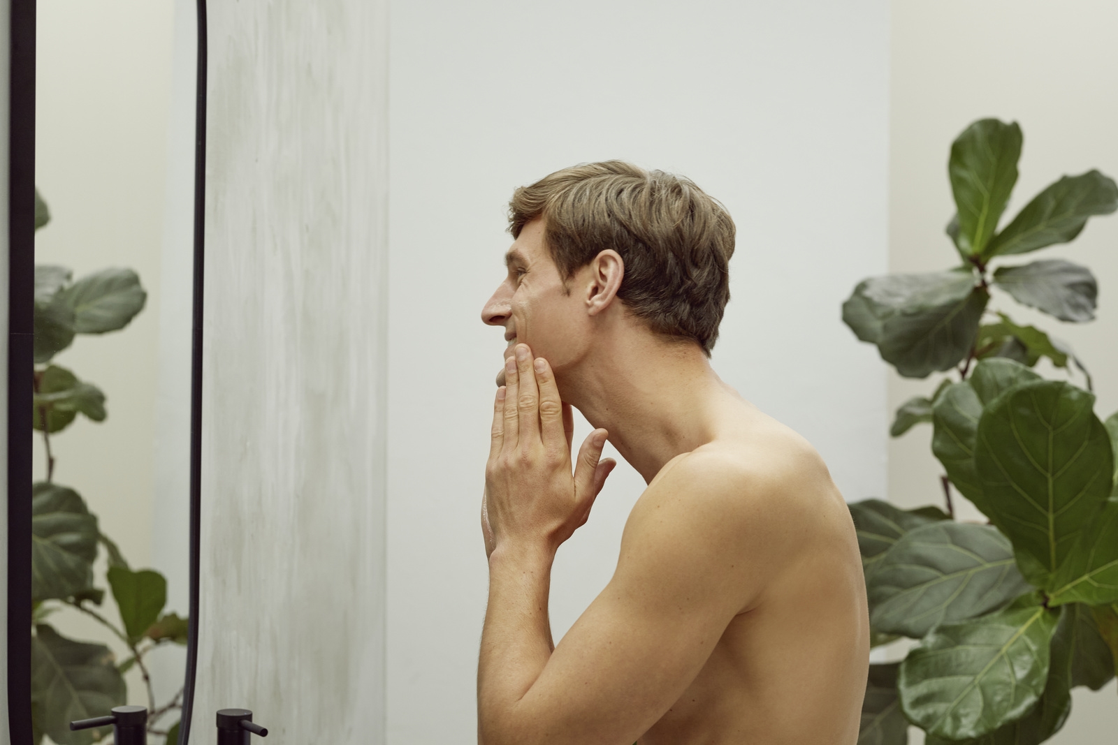 Men standing in front of mirror