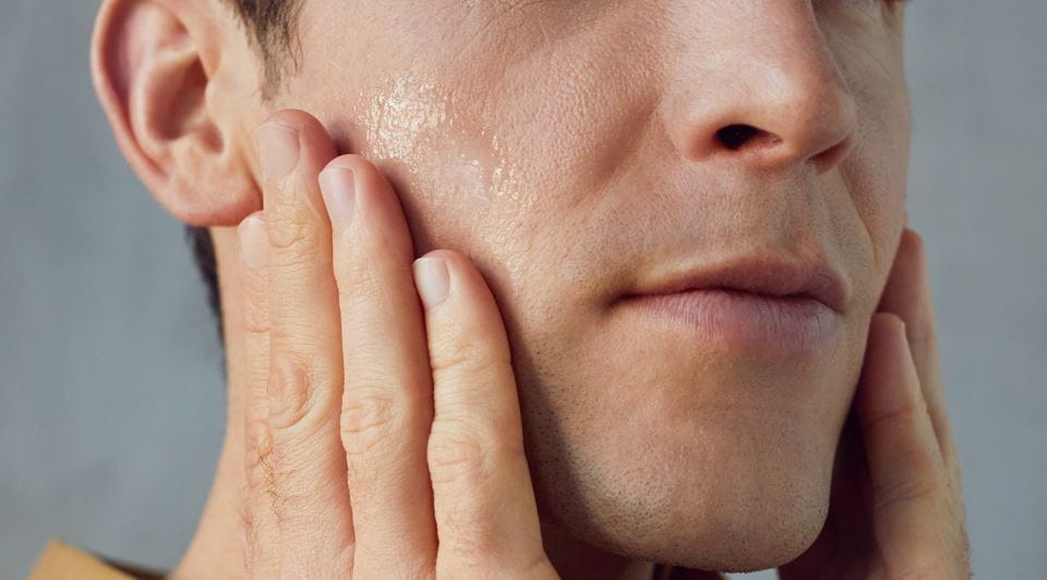 Man applying face cream