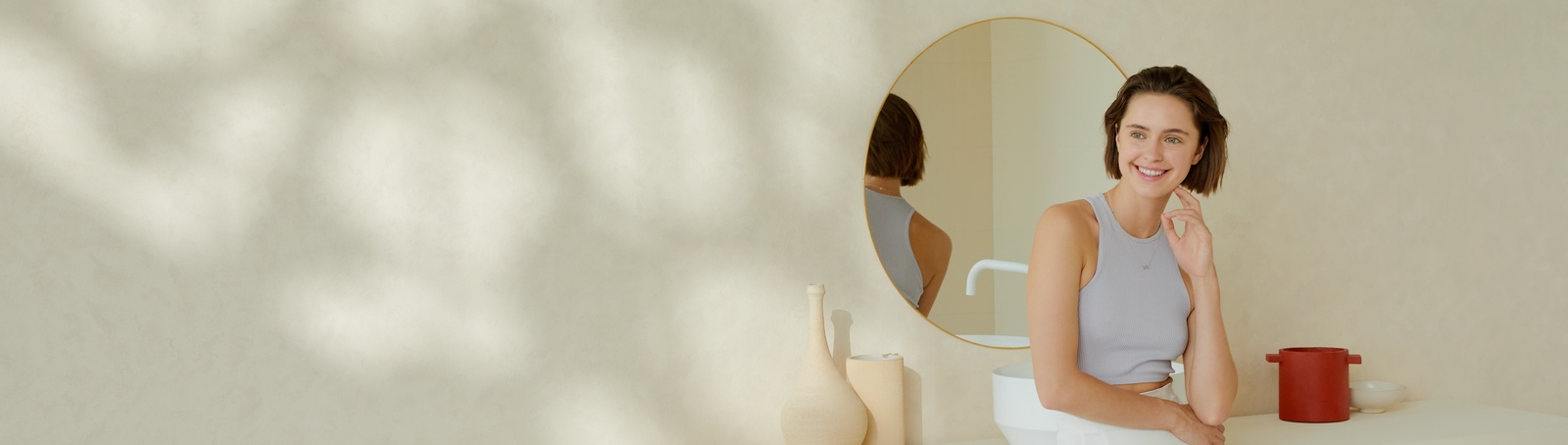 Woman smiling in bathroom