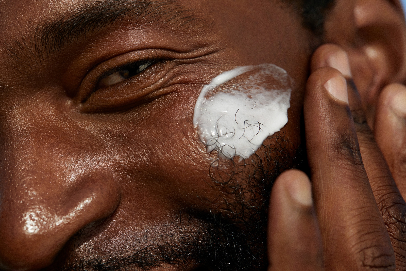 Men applying face cream