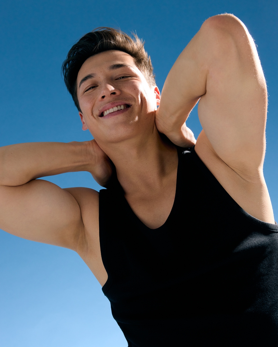 Men smiling under the blue sky