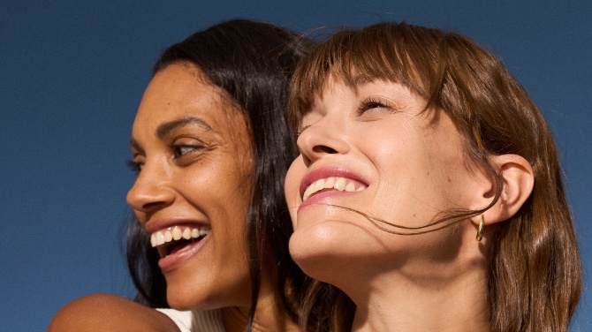 Two woman smiling