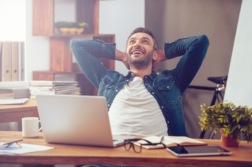man in denim relaxing on his chair