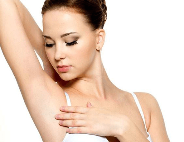 woman looking at her armpit