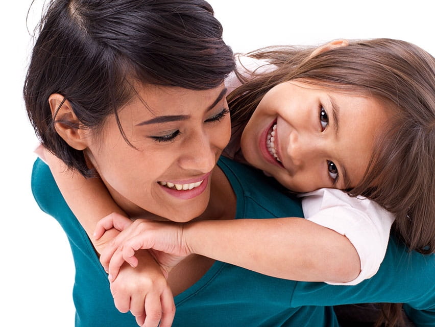 mom carrying her daughter