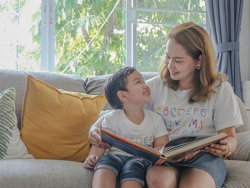 mom and son reading a book