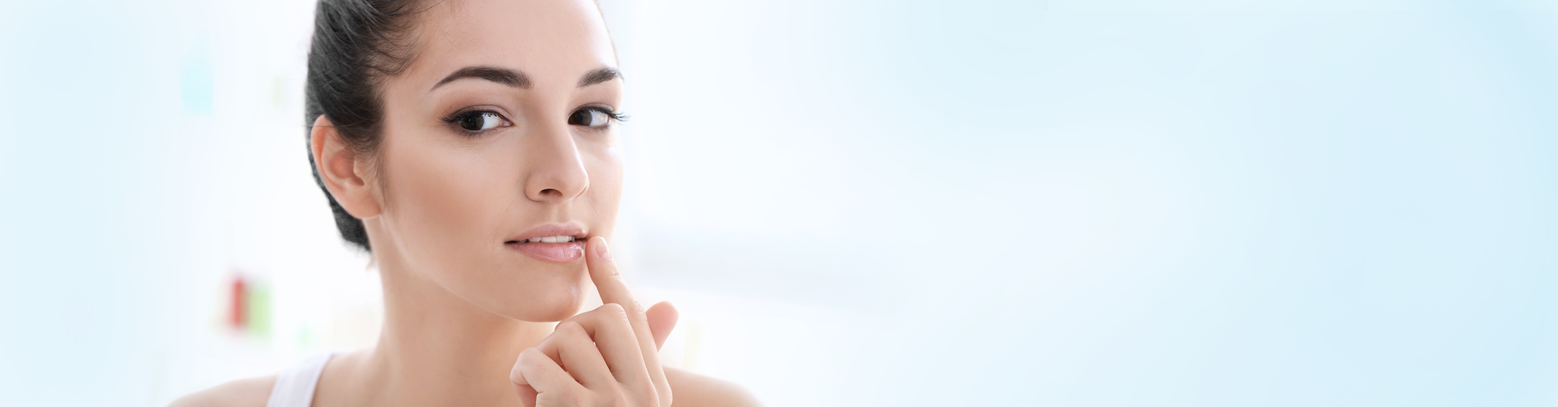 woman touching her dry lips