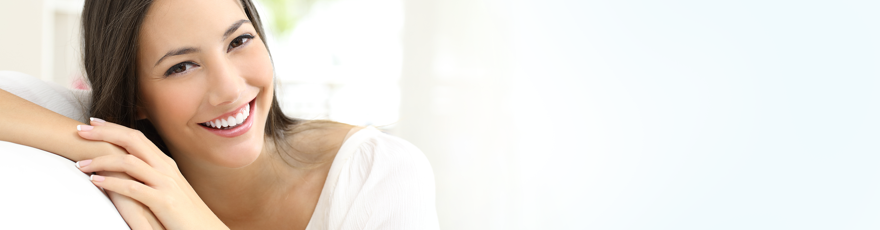 woman in white shirt smiling