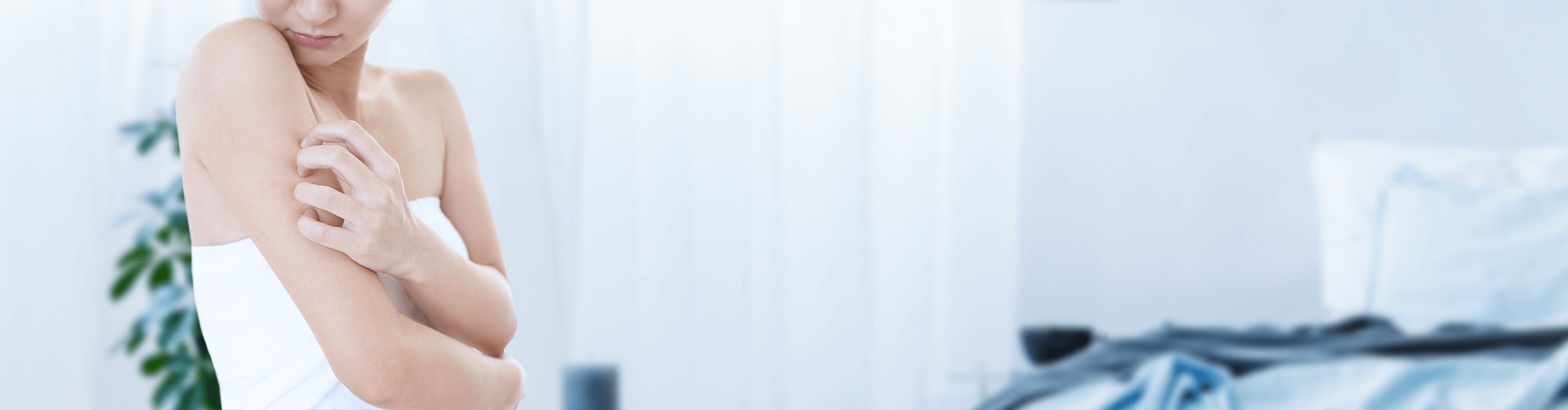 woman scratching her arm