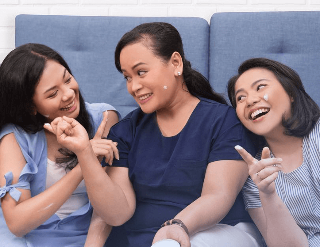 three woman applying NIVEA Creme