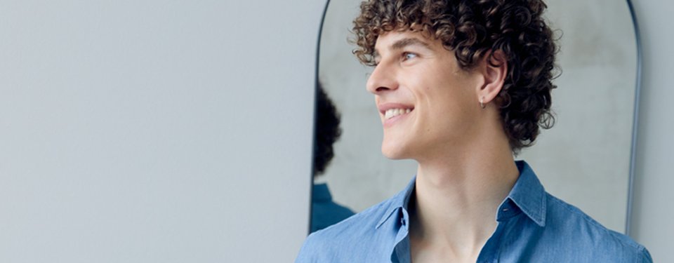 men in denim smiling