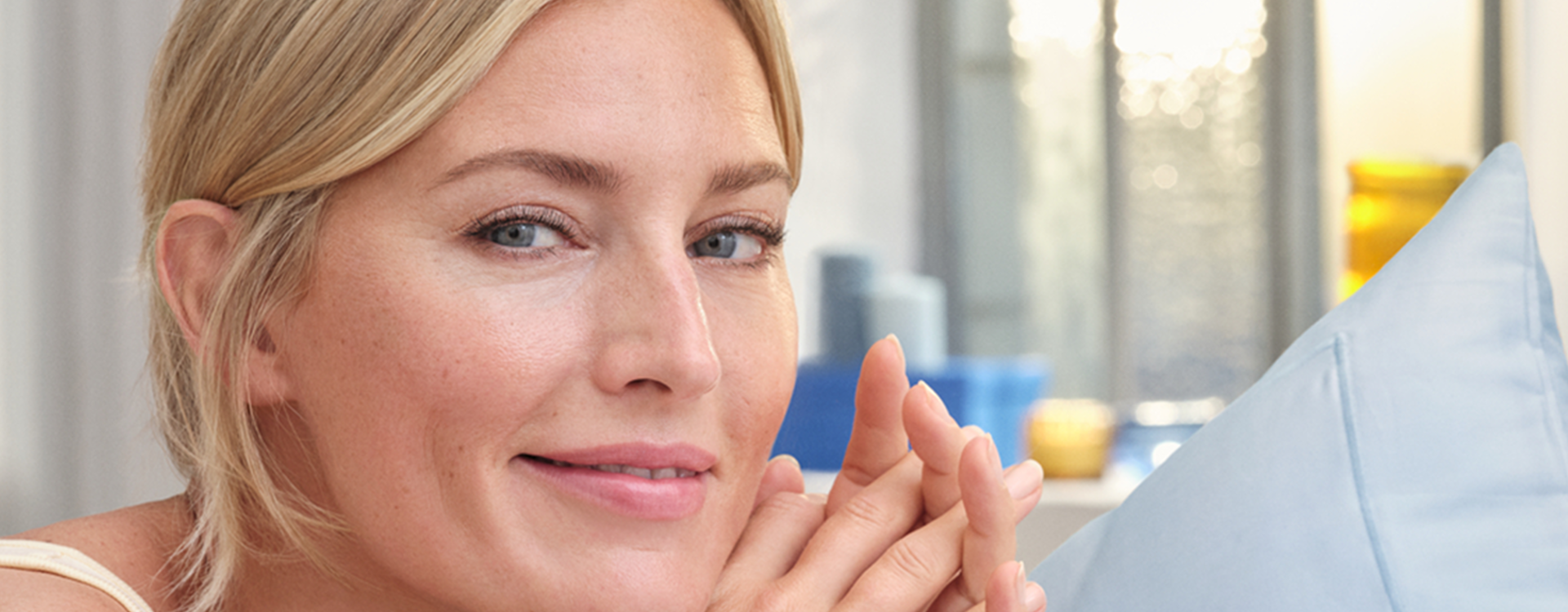 blonde woman with grey eyes