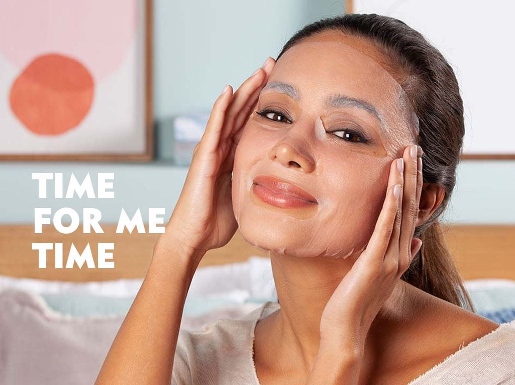 A Woman Pampering Herself using a Face Mask