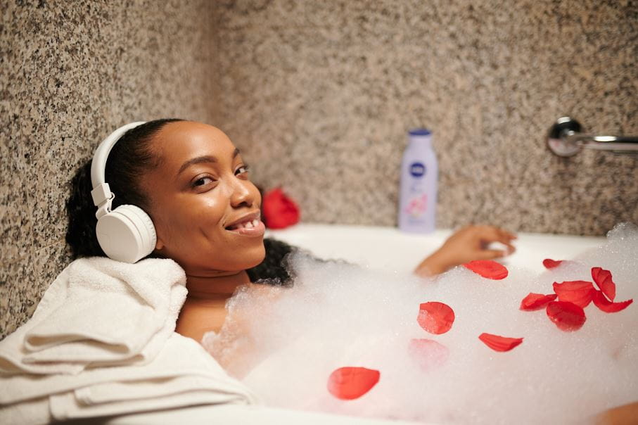 Lady in the bath tub with NIVEA Oil in Lotion product